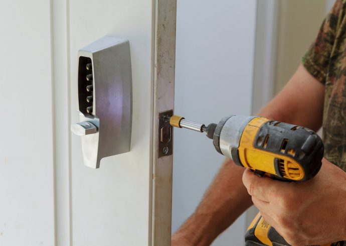 man-installing-of-the-door-with-lock-key-security.jpg